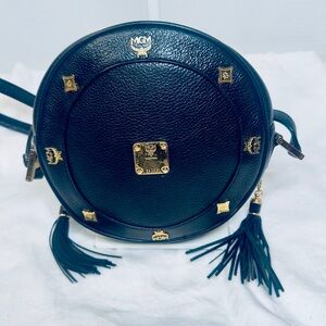 MCM Round Black Crossbody Bag with Gold Accents